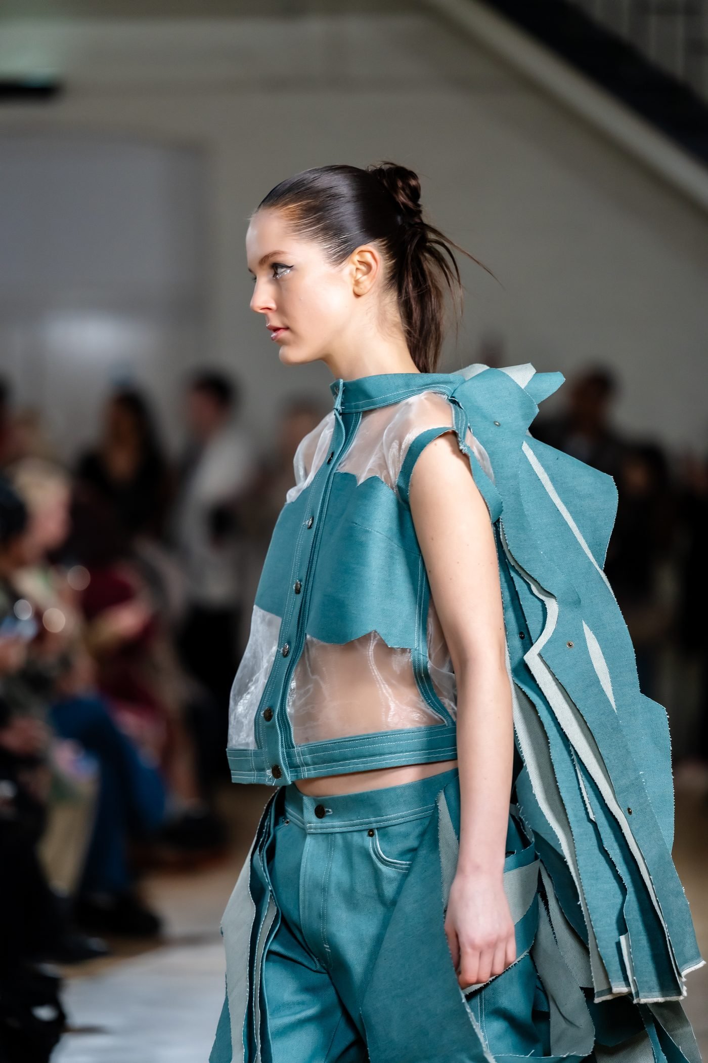 Side view of teal runway look